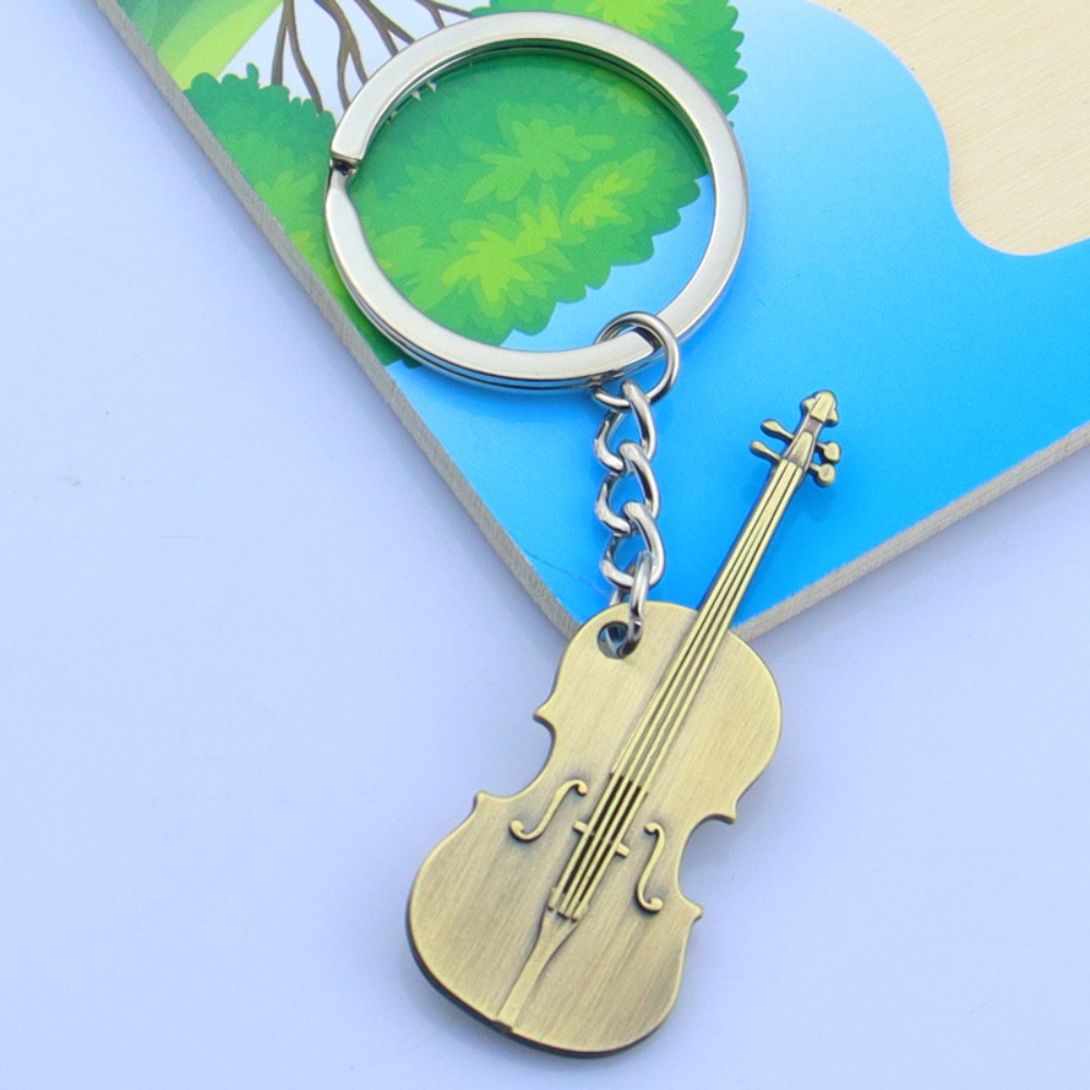 Llavero de guitarra de metal g - Musical Instruments Cartoon reseña y precio